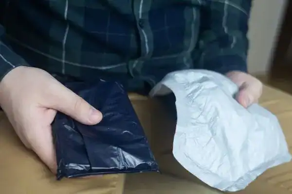 image of man holding stool incontinence Bolton products